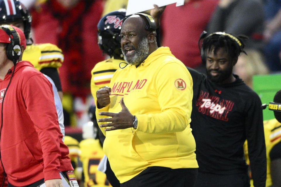Maryland head coach Mike Locksley, center, reacts during the second half of an NCAA college football game against Penn State, Saturday, Nov. 4, 2023, in College Park, Md. (AP Photo/Nick Wass)