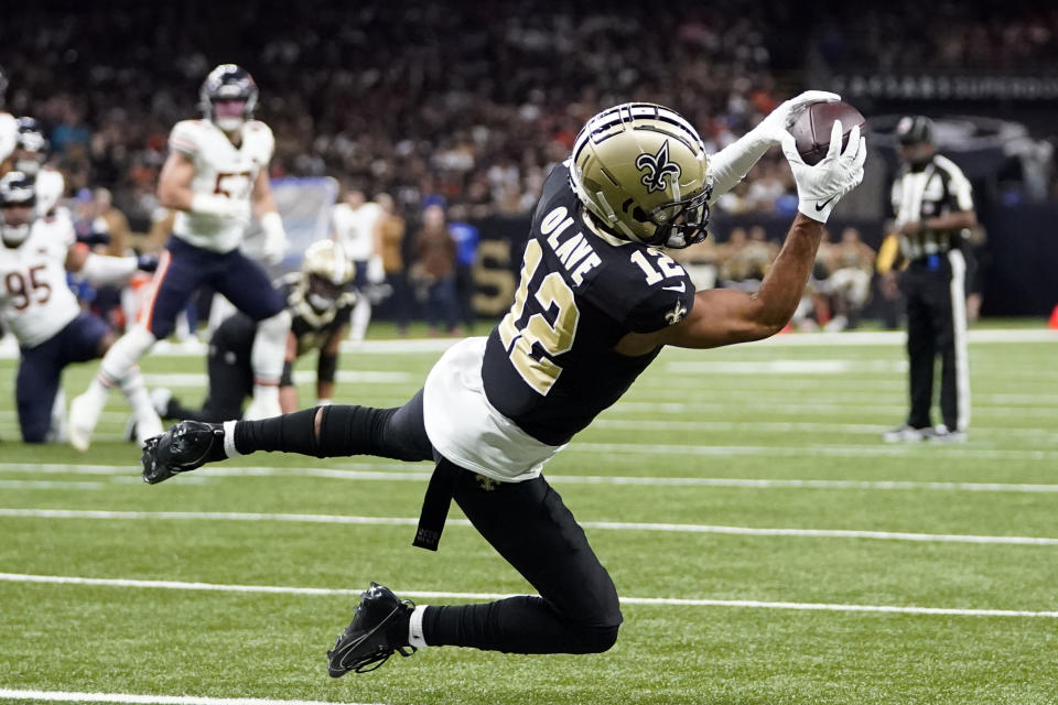 New Orleans Saints wide receiver Chris Olave (12) makes a touchdown catch during the first half of an NFL football game against the New Orleans Saints in New Orleans, Sunday, Nov. 5, 2023. (AP Photo/Gerald Herbert)