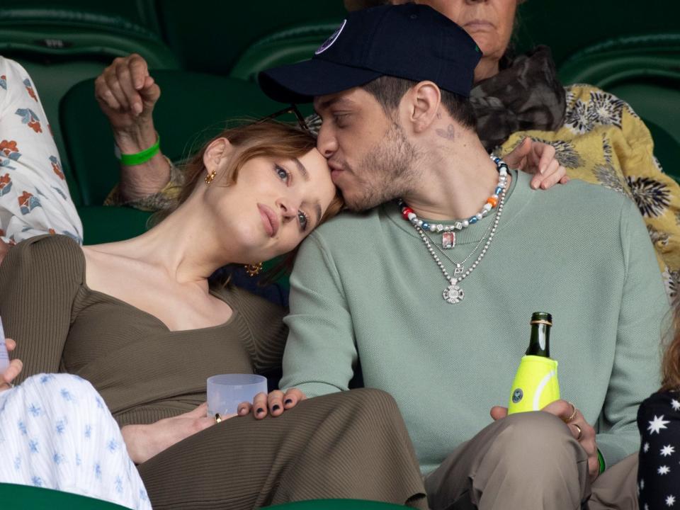 Phoebe Dynevor leaning her head on Pete Davidson's shoulder while in attendance at Wimbledon in July 2021.