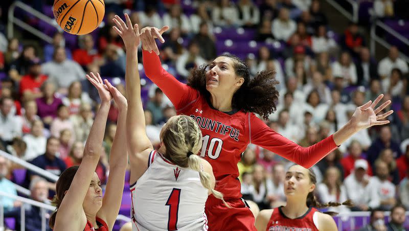 Bountiful’s Taylor Harvey blocks a shot by Springville’s Ellie Esplin as Bountiful’s Hayley Smith guards Esplin during the 5A girls basketball championship game at the Dee Events Center in Ogden, on Saturday, March 4, 2023. Bountiful won 41-39.