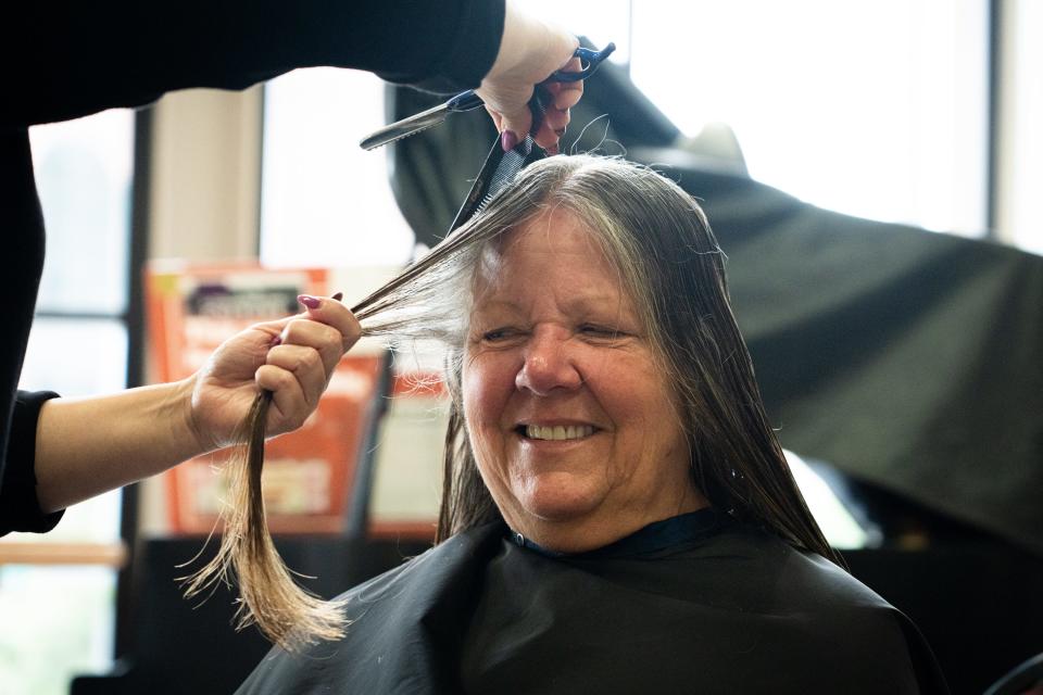 Zeta Forsyth gets her hair cut by stylist Jennifer Cruz, who gives free haircuts every few months for "At the Well." Sometimes Cruz hears from grateful women who landed a job after their last haircut at the event.