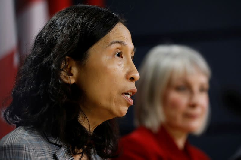 Canada's Chief Public Health Officer Dr. Theresa Tam, with Minister of Health Patty Hajdu, takes part in a news conference in Ottawa