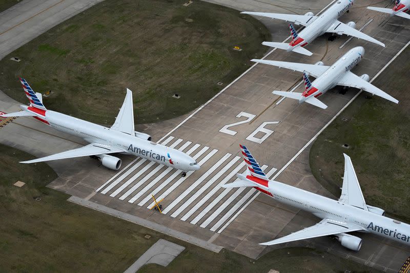 American Airlines passenger planes crowd a runway in Tulsa