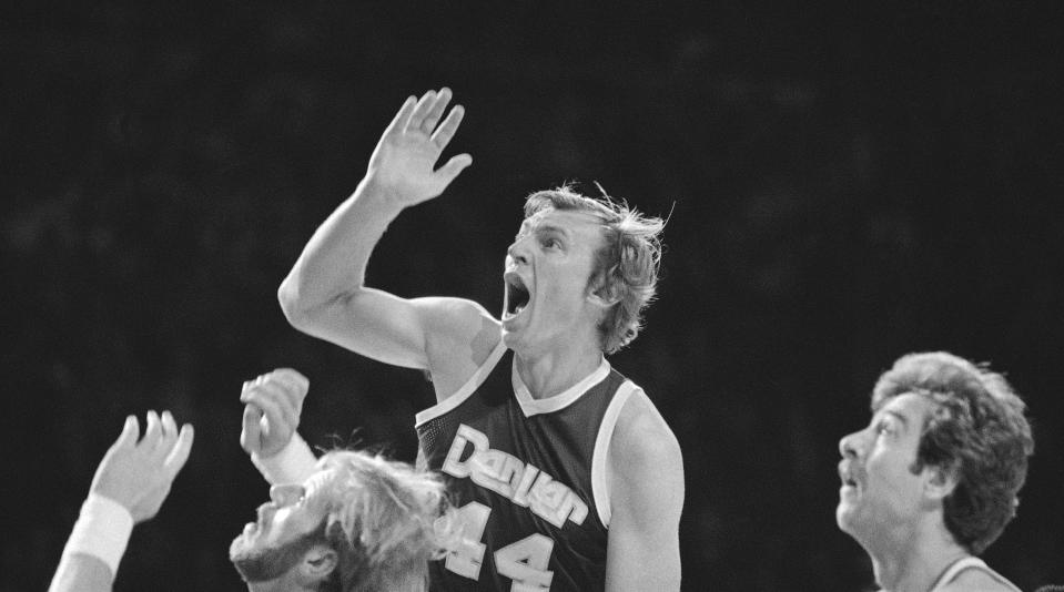 FILE - Denver's Dan Issel reacts as he watches his shot fall short of the basket as he shot over Kent Benson of the Milwaukee Bucks during first quarter of an NBA basketball game on Wednesday, Oct. 17, 1979 in Milwaukee. The Denver Nuggets are the last of the four ABA teams that merged with the NBA to reach the Finals and is stirring up fond memories of the defunct league. (AP Photo/Pyle, File)