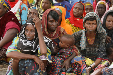 FILE PHOTO: Nigerian returnees from Niger wait to be processed by the Nigeria Immigration service in Damasak, Borno, Nigeria April 25, 2017. REUTERS/Afolabi Sotunde/File Photo