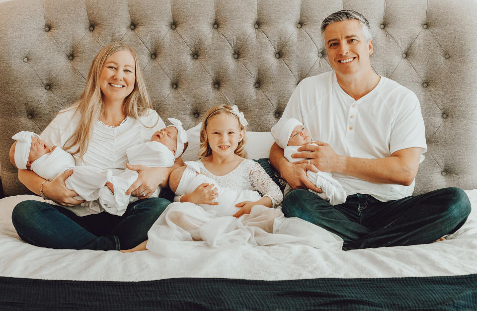 Big sister Isla loves helping her parents with the babies. (Michaella Diamond Photography)