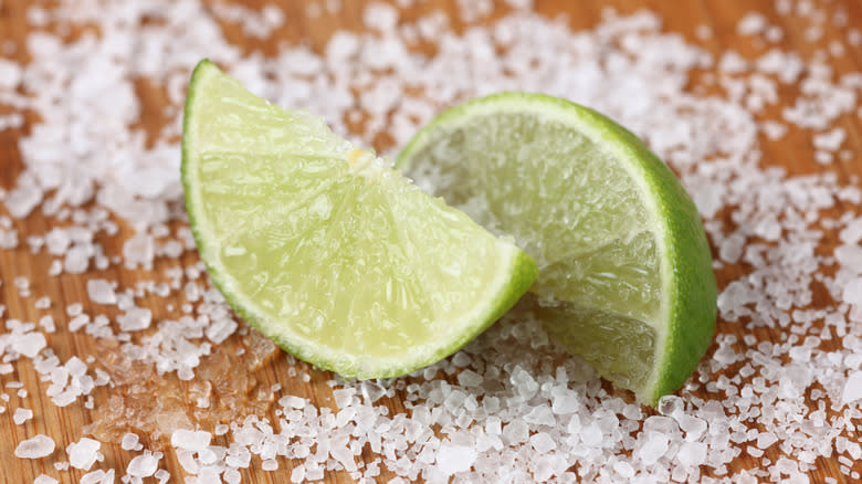 Lime wedges resting in salt 