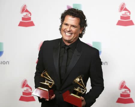 Carlos Vives poses with his awards for Record of the Year and Song of the Year for "La Bicicleta" during the 17th Annual Latin Grammy Awards in Las Vegas, Nevada, U.S., November 17, 2016. REUTERS/Steve Marcus