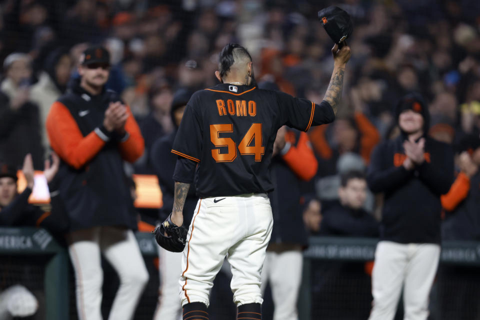 San Francisco Giants pitcher Sergio Romo (54) acknowledges the crowd after walking off the mound during the seventh inning of a spring training baseball game against the Oakland Athletics in San Francisco, Monday, March 27, 2023. (AP Photo/Jed Jacobsohn)