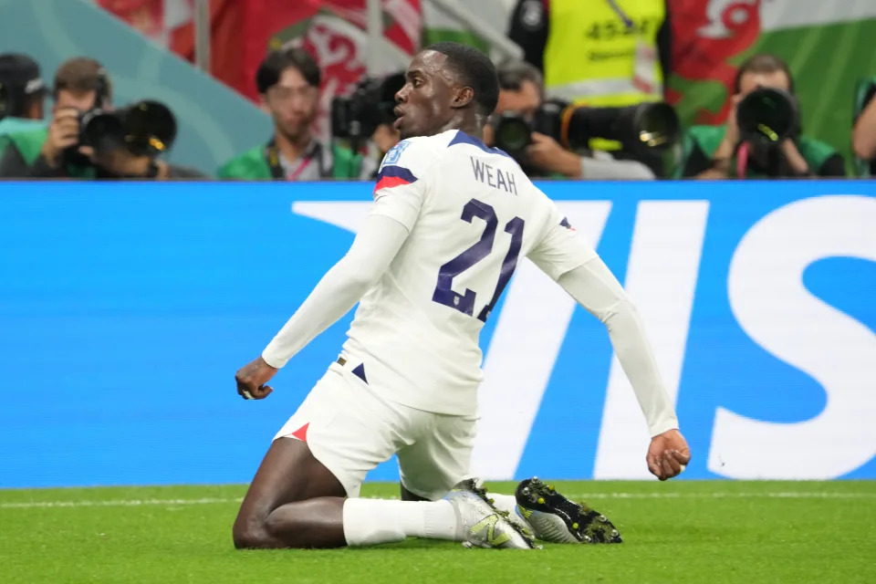 DOHA, QATAR - NOVEMBER 21: Timothy Weah of USA celebrates scoring his side&#39;s first goal during the FIFA World Cup Qatar 2022 Group B match between USA and Wales at Ahmad Bin Ali Stadium on November 21, 2022 in Doha, Qatar. (Photo by Etsuo Hara/Getty Images)