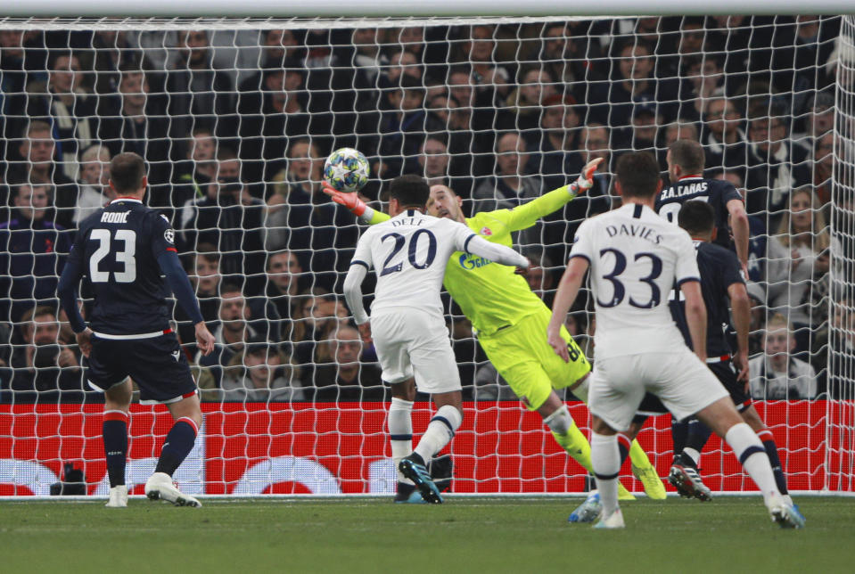 Red Star's goalkeeper Milan Borjan fails to save a shot by Tottenham's Harry Kane during the Champions League, group B, soccer match between Tottenham and Red Star Belgrade, at the Tottenham Hotspur stadium in London, Tuesday, Oct. 22, 2019. (AP Photo/Ian Walton)