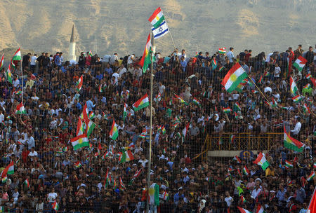 An Israeli flag and Kurdish flags are seen during a rally to show their support for the upcoming September 25th independence referendum in Duhuk, Iraq September 16, 2017. REUTERS/Ari Jalal