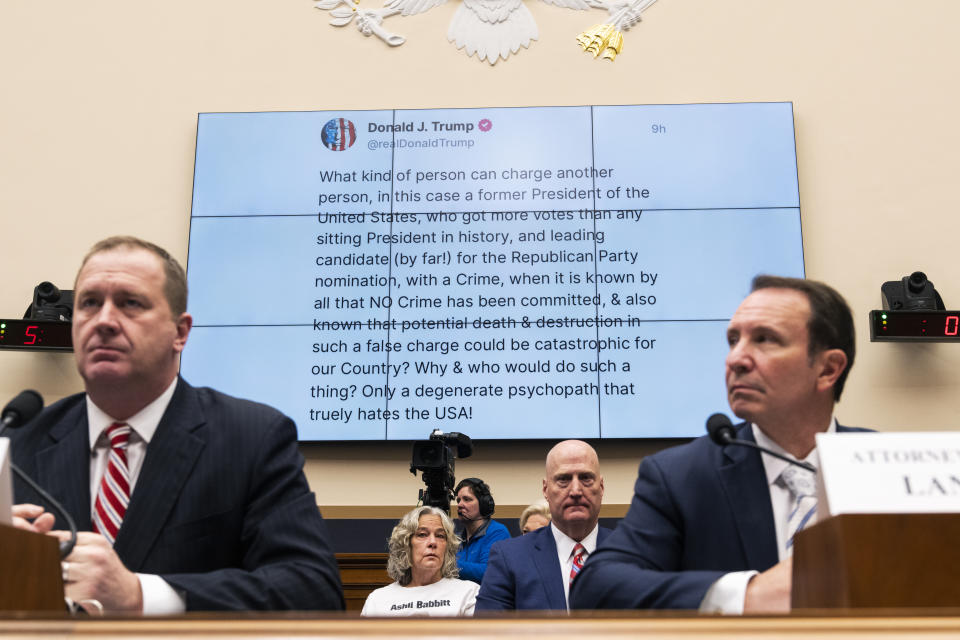 Micki Witthoeft, center, the mother of Jan. 6 rioter Ashli Babbitt, with Sen. Eric Schmitt, left, and Louisiana Attorney General Jeff Landry