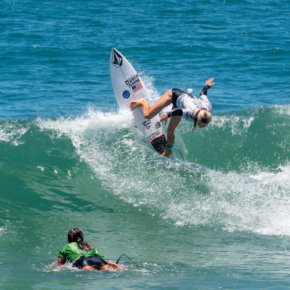 Lanea Mons, right, hits the lip of a wave during the World Junior Surfing Championship in Brazil. The Atlantic Beach teen took second place in the Under 16 Girls division of the competition that drew participants from nearly 50 countries.