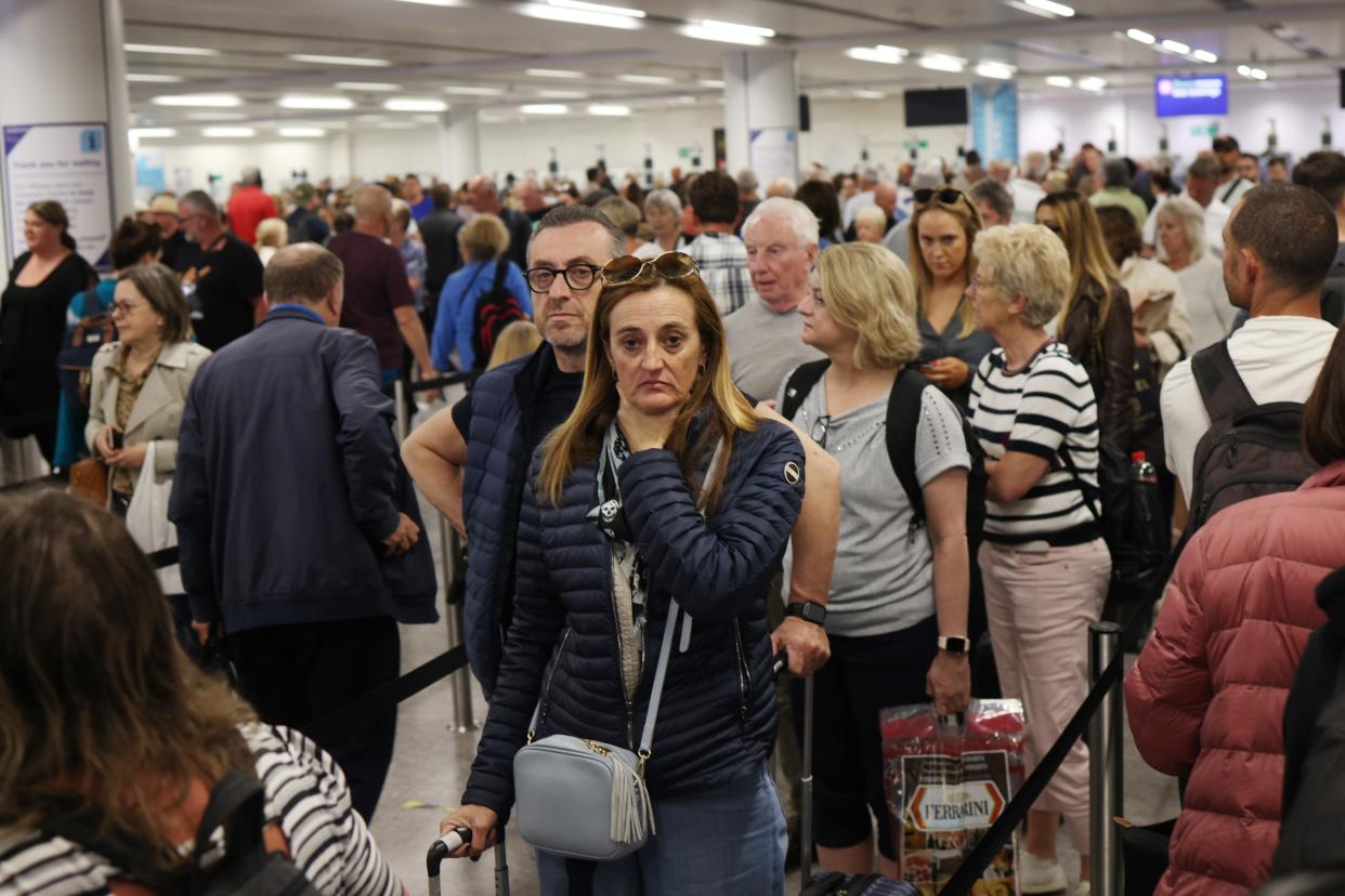 Passengers queue at Gatwick Airport as electronic passport gates fail across the UK (Getty Images)
