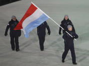 <p>Matthieu Osch carries the flag of Luxembourg during the opening ceremony of the 2018 Winter Olympics in Pyeongchang, South Korea, Friday, Feb. 9, 2018. (AP Photo/Michael Sohn) </p>