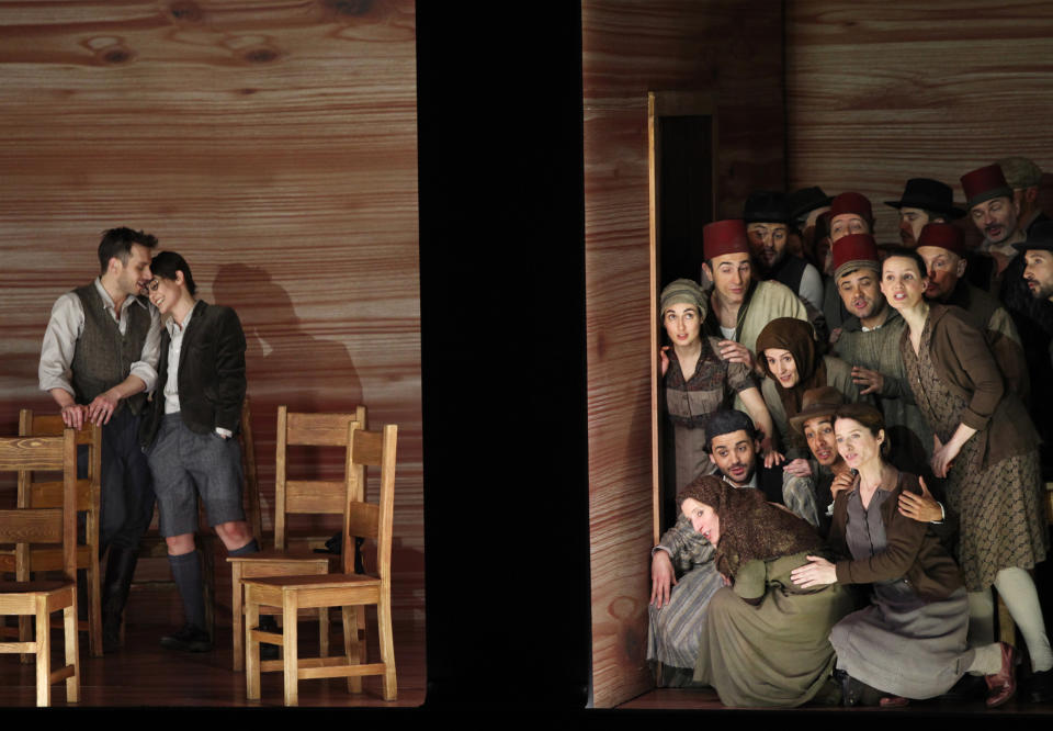 In this April 15, 2013 photo provided by the Brooklyn Academy of Music countertenor Pascal Charbonneau, left, performs the role of David opposite soprano Ana Quintans, in the role of Jonathas as the rest of the cast gathers at the right during a final dress rehearsal of Charpentier’s opera "David et Jonathas," at the Brooklyn Academy of Music, in New York. (AP Photo/Brooklyn Academy of Music, Julieta Cervantes) BAM Howard Gilman Opera House April 15, 2013 Photo Credit: Julieta Cervantes