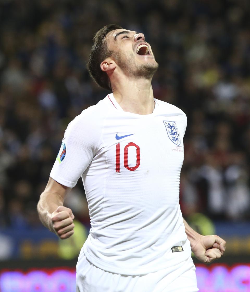 England's Harry Winks celebrates after scoring the opening goal of his team during the Euro 2020 group A qualifying soccer match between Kosovo and England at Fadil Vokrri stadium in Pristina, Kosovo, Sunday, Nov. 17, 2019. (AP Photo/Boris Grdanoski)