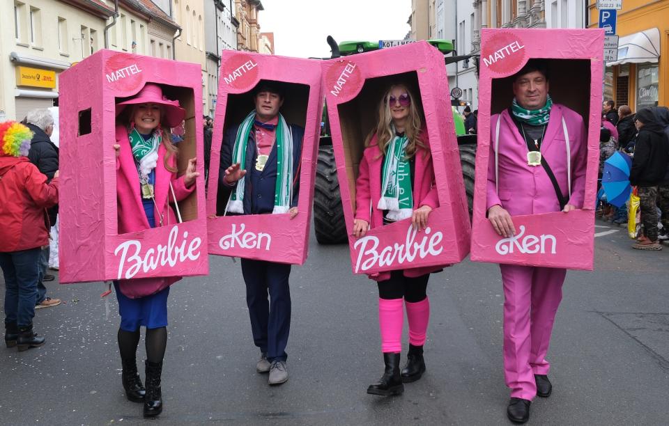 20 February 2023, Saxony-Anhalt, Köthen: Carnival friends in costumes of Barbie and Ken walk through the city center. After a two-year forced break due to the Corona pandemic, Köthen once again hosted a large carnival parade. Photo: Sebastian Willnow/dpa (Photo by Sebastian Willnow/picture alliance via Getty Images)