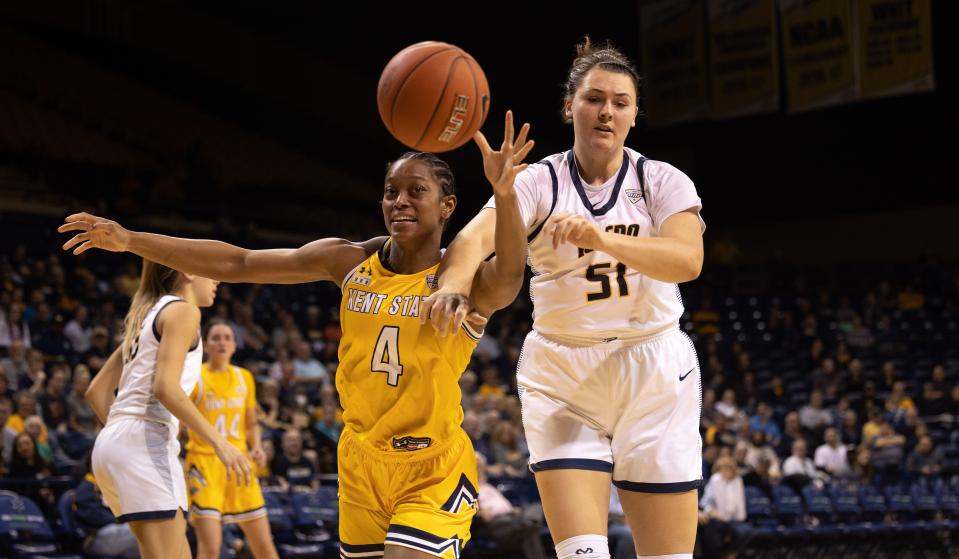 Kent State junior forward Nila Blackford and Toledo junior center Hannah Noveroske battle for the ball during Monday night's WNIT game at the University of Toledo's Savage Arena.