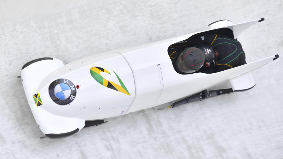 Jazmine Fenlator-Victorian and Carrie Russell of Jamaica speed down the track at the women’s bobsled World Cup race in Innsbruck. (AP Photo)