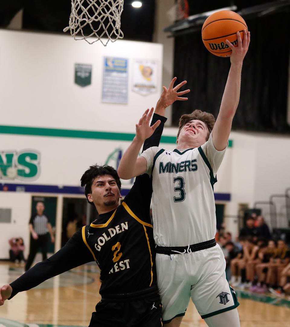 El Diamante's Santana Guijarro drives to the basket against Golden West during their East Yosemite League high school boys basketball game on Tuesday, Jan. 23, 2024.