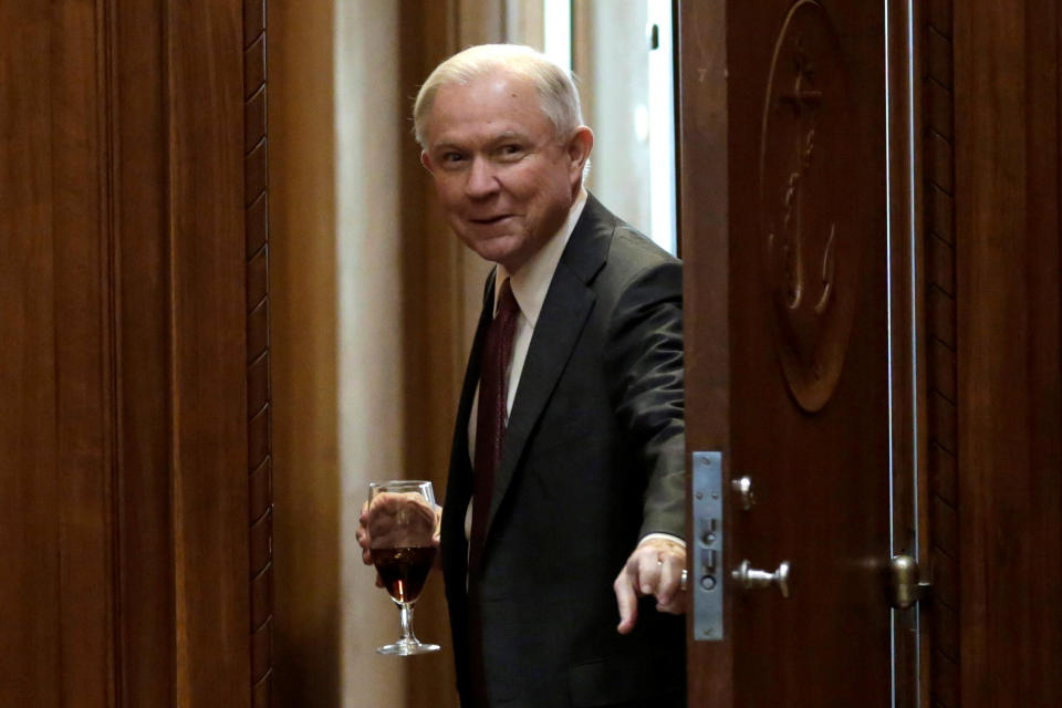 U.S. Attorney General Jeff Sessions opens a door before his first meeting with heads of federal law enforcement components at the Justice Department in Washington, U.S., February 9, 2017. REUTERS/Yuri Gripas TPX IMAGES OF THE DAY