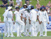 India’s Mohammed Shami, center, looks back at the departure of New Zealand’s Kane Williamson whose wicket he took for 47 on the first day of the second cricket test in Wellington, New Zealand, Friday, Feb. 14, 2014.