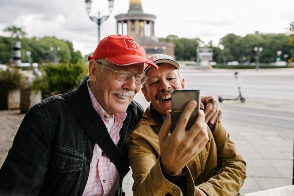 Two adults taking a selfie. 