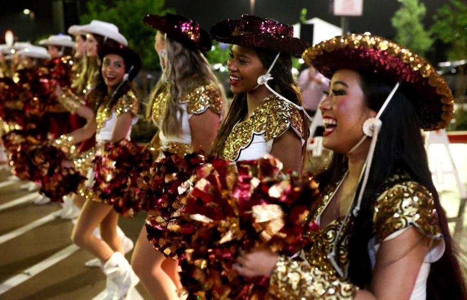 Members of the Keller Central High School Lightning Dancers dance in the parking lot as part of the festivities of the opening of the Fort Worth Alliance H-E-B