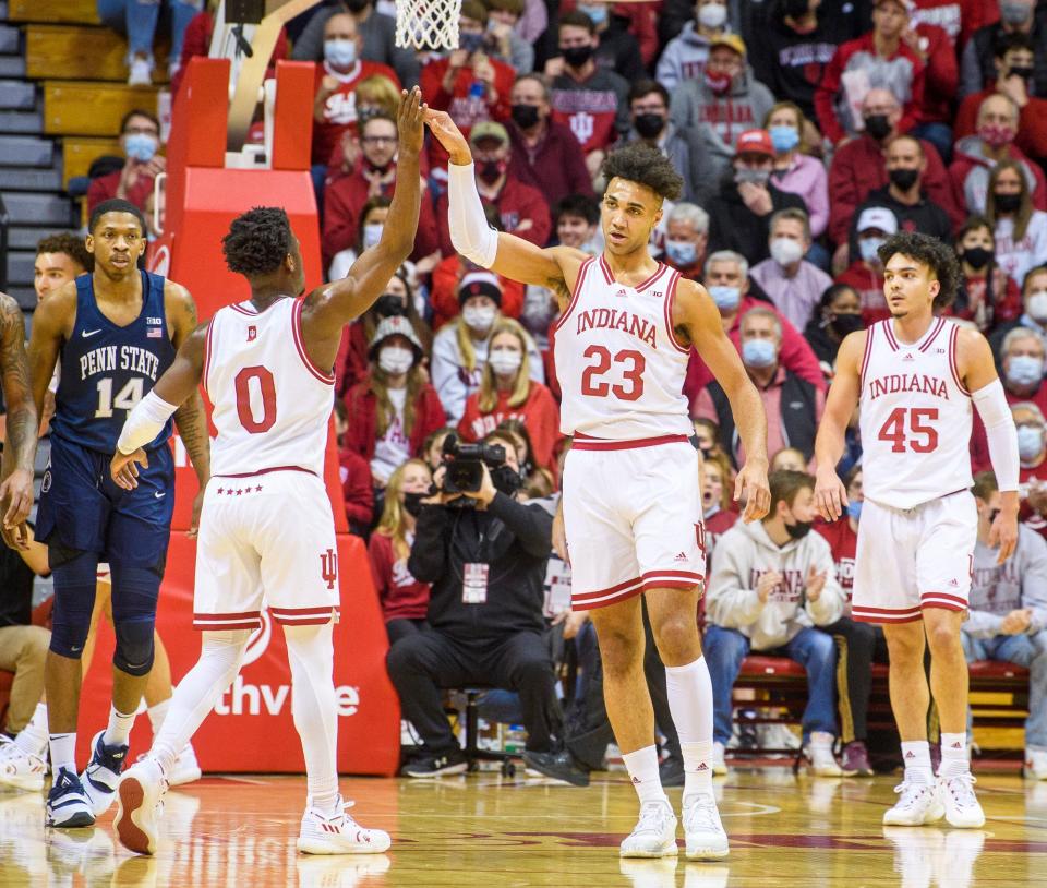 Indiana's Xavier Johnson (0) aand Trayce Jackson-Davis (23) celebrate a Jackson-Davis block during the first half of the Indiana versus Penn State men's basketball game at Simon Skjodt Assembly Hall.