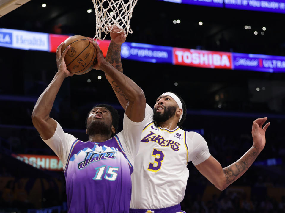 LOS ANGELES, CALIFORNIA - APRIL 09: Damian Jones #15 of the Utah Jazz attempts a shot in front of Anthony Davis #3 of the Los Angeles Lakers during the first half at Crypto.com Arena on April 09, 2023 in Los Angeles, California. NOTE TO USER: User expressly acknowledges and agrees that, by downloading and or using this photograph, User is consenting to the terms and conditions of the Getty Images License Agreement. (Photo by Harry How/Getty Images)