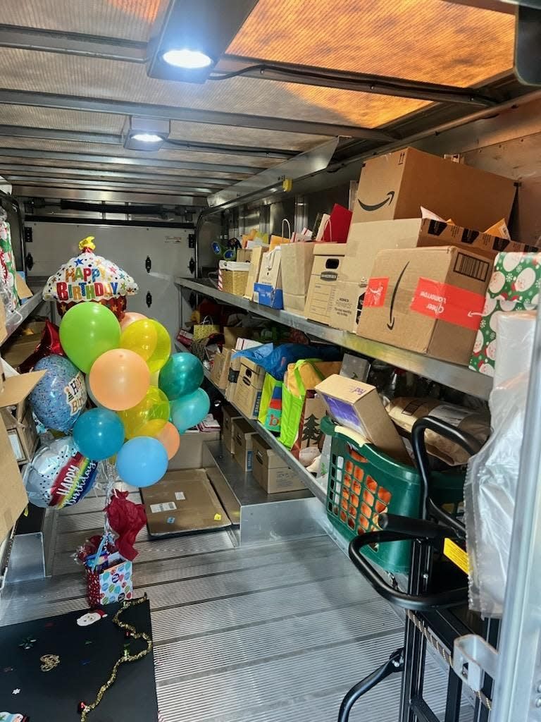 The interior of a UPS van is crammed with presents that were transported Tuesday from New Philadelphia to Conesville for Andrew Miller.