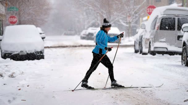 PHOTO: A cross-country skier navigates the street after a winter storm packing heavy snow enveloped the intermountain West, Jan. 18, 2023, in Denver. (David Zalubowski/AP)