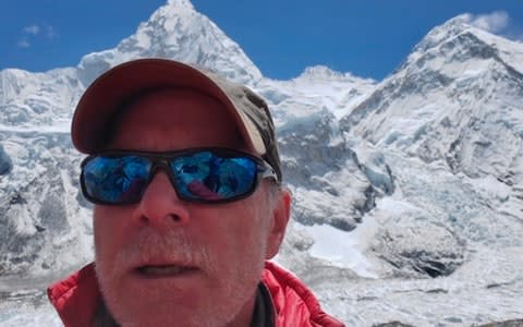 Christopher Kulish beneath Mount Everest - Credit: AP