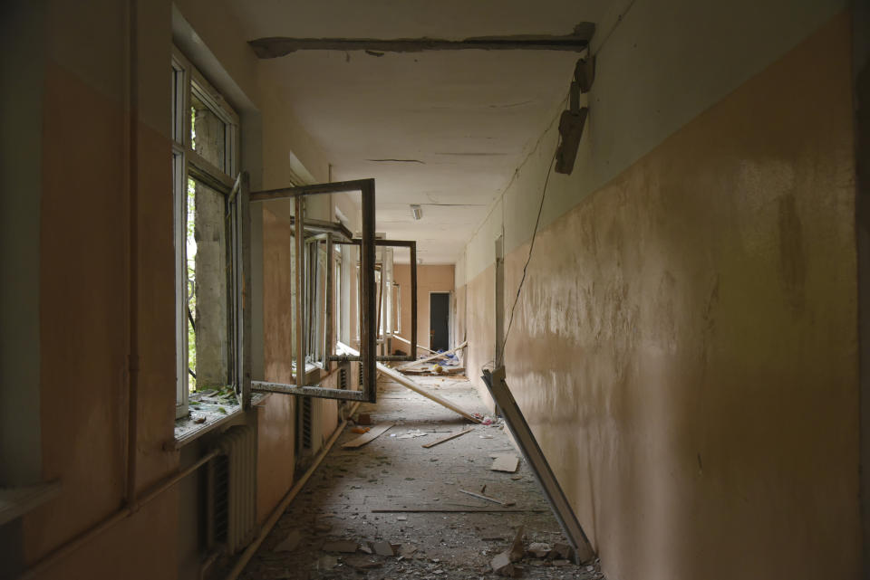 A view of the damage in a corridor of school after shelling by Azerbaijan's artillery during a military conflict in Stepanakert, self-proclaimed Republic of Nagorno-Karabakh, Azerbaijan, Monday, Oct. 5, 2020. Armenia accused Azerbaijan of firing missiles into the capital of the separatist territory of Nagorno-Karabakh, while Azerbaijan said several of its towns and its second-largest city were attacked. (David Ghahramanyan/NKR InfoCenter PAN Photo via AP)