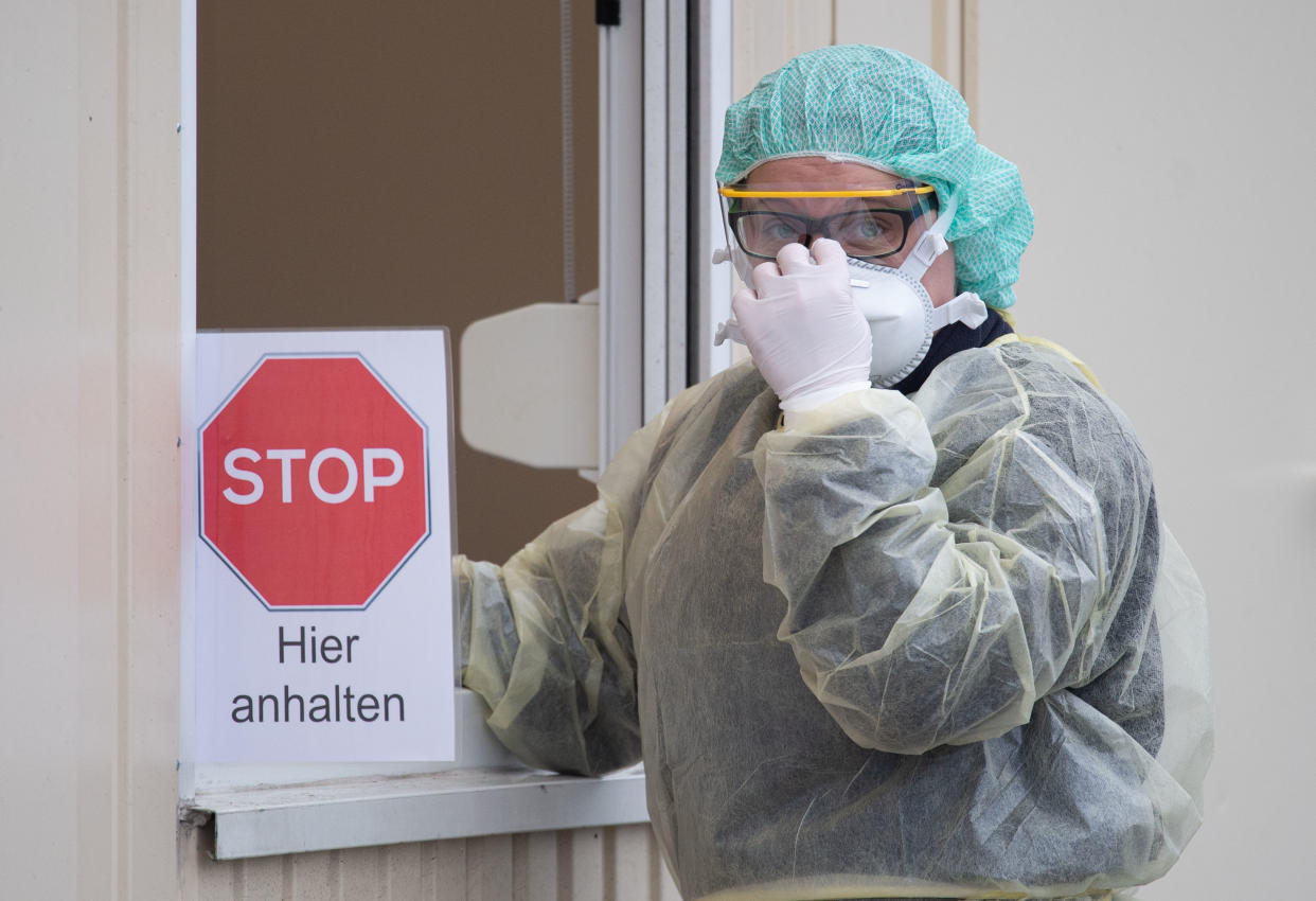 09 March 2020, Baden-Wuerttemberg, Nürtingen: A hospital employee stands at a container during a press appointment for the start of a "drive-in" test station. (to dpa "First "Drive-In" test stations for Coronavirus go into operation") Photo: Marijan Murat/dpa (Photo by Marijan Murat/picture alliance via Getty Images)