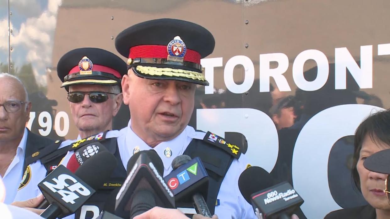 Toronto Police Chief Myron Demkiw speaks to reporters during a community walk in Etobicoke on Thursday following a mass shooting late Sunday that has left two men dead and three others injured. (CBC - image credit)