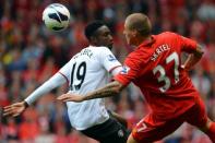 Manchester United striker Danny Welbeck (left) vies with Liverpool's Slovakian defender Martin Skrtel during the Premier League football match between Liverpool and Manchester United at Anfield in Liverpool. Ten-man Liverpool were left searching for their first Premier League win under new manager Brendan Rodgers as arch-rivals Manchester United came from behind to win 2-1 at an emotional Anfield