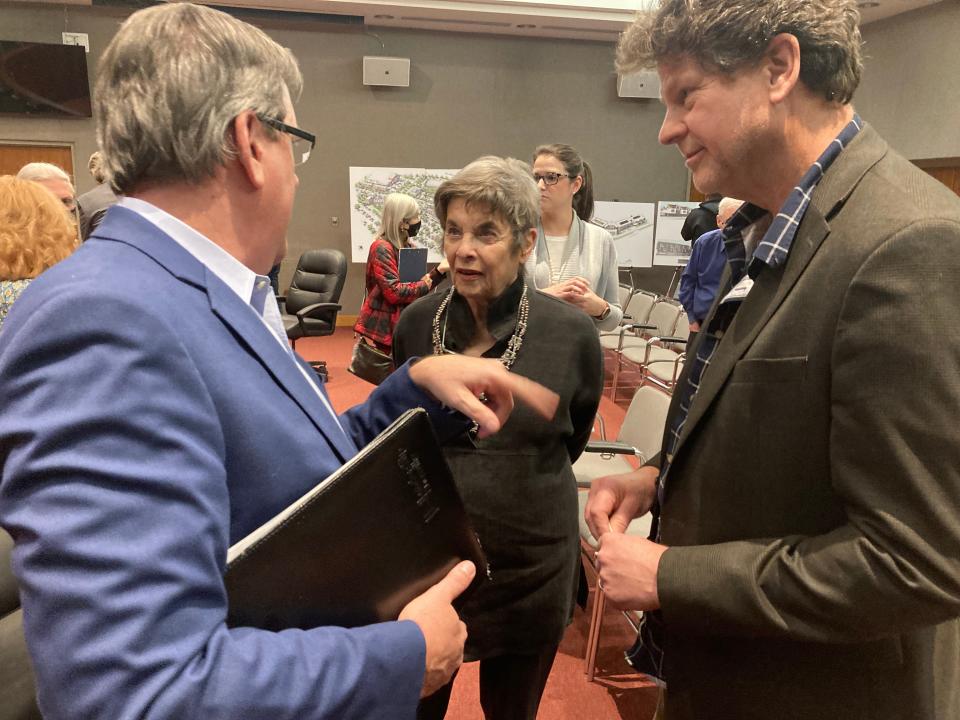 Scott Busby, left, and Gregor Smee with Smee Busby, the architecture firm working with Cappiello Real Estate, talk to Pat Postma after a meeting of the Oak Ridge Land Bank.