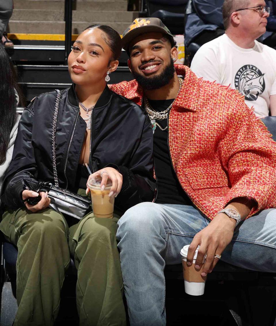 Jordyn Woods, and Karl-Anthony Towns #32 of the Minnesota Timberwolves pose for a photo during a game between the Las Vegas Aces and the Minnesota Lynx on May 1, 2022 at Target Center in Minneapolis, Minnesota