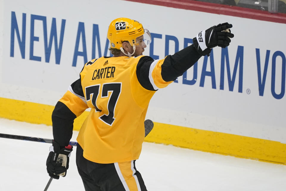 Pittsburgh Penguins' Jeff Carter celebrates his goal in the first period in Game 2 of an NHL hockey Stanley Cup first-round playoff series against the New York Islanders in Pittsburgh, Tuesday, May 18, 2021. (AP Photo/Gene J. Puskar)