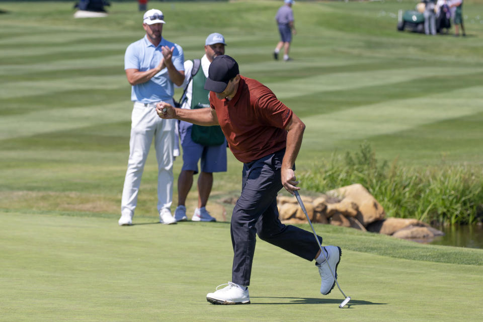 Tony Romo reacts after sinking the winning putt on the 18th hole during the final round of the American Century Celebrity Championship golf tournament at Edgewood Tahoe Golf Course in Stateline, Nev., Sunday, July 10, 2022. (AP Photo/Tom R. Smedes)