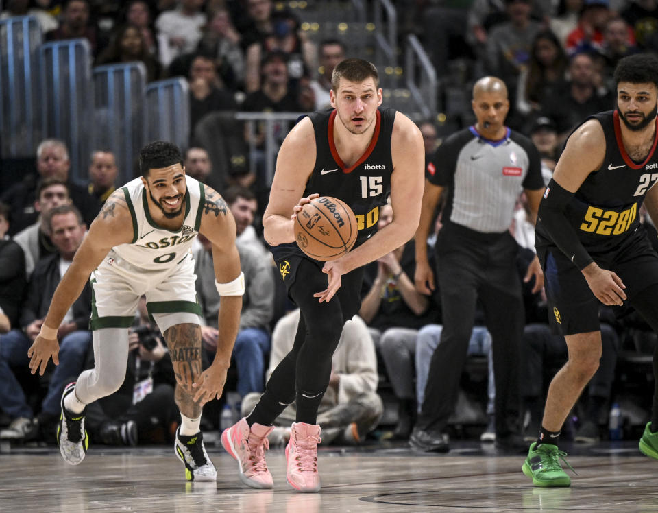 DENVER, CO - MARCH 7: Nikola Jokic (15) of the Denver Nuggets steals the ball from Jayson Tatum (0) of the Boston Celtics during the second quarter at Ball Arena in Denver on Thursday, March 7, 2024. (Photo by AAron Ontiveroz/The Denver Post)