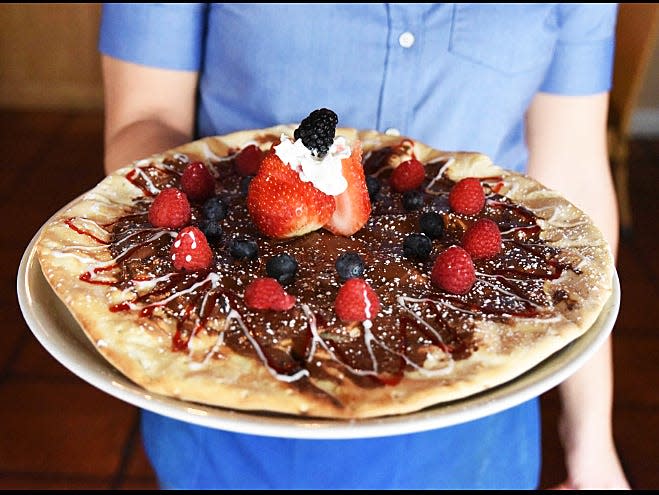 Pizza al Fresco’s Nutella pizza comes topped with Nutella, strawberries, raspberries and a house-made raspberry sauce drizzle.