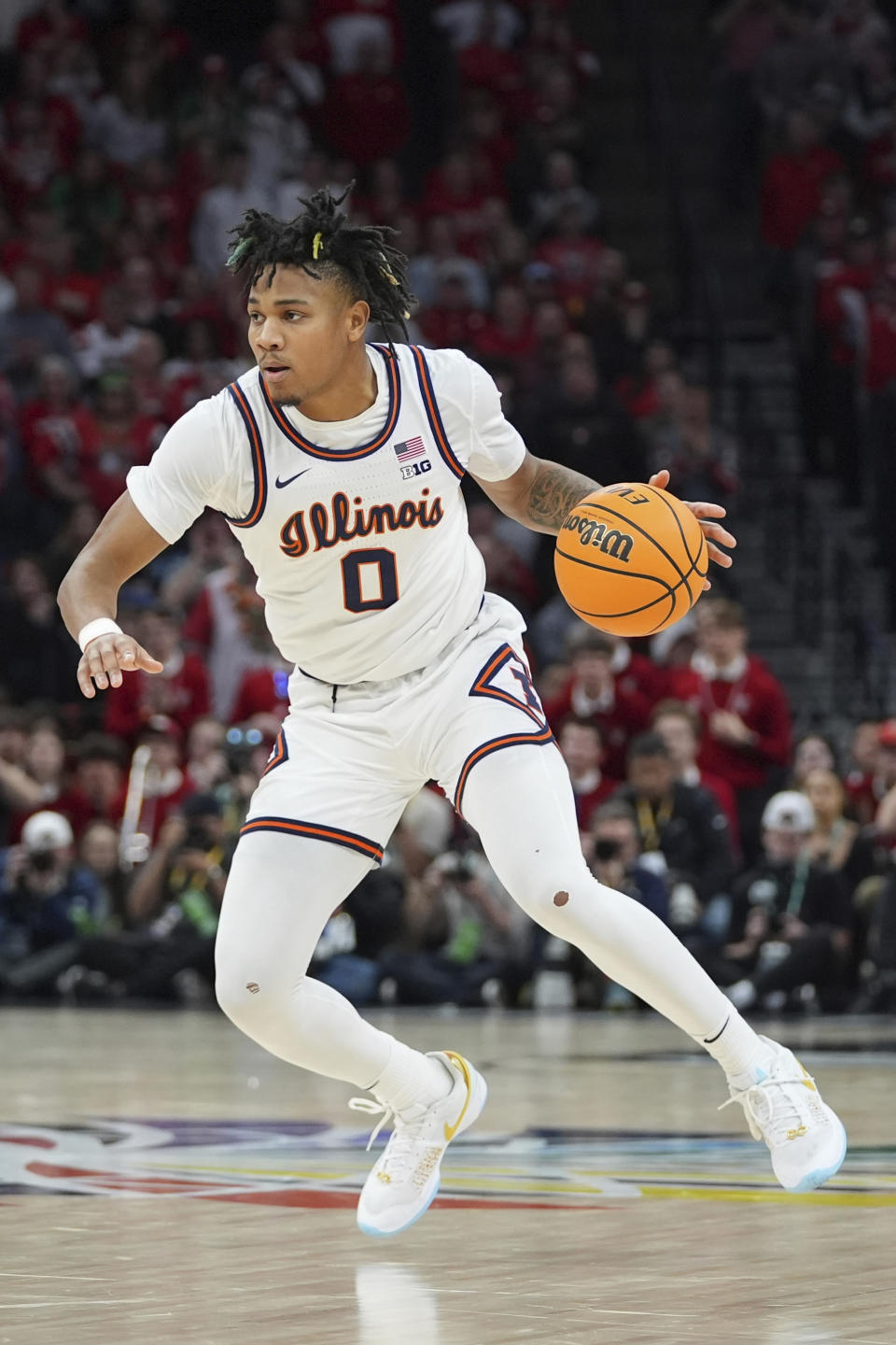 Illinois guard Terrence Shannon Jr. (0) works toward the basket during the second half of an NCAA college basketball game against Wisconsin in the championship of the Big Ten Conference tournament, Sunday, March 17, 2024, in Minneapolis. (AP Photo/Abbie Parr)