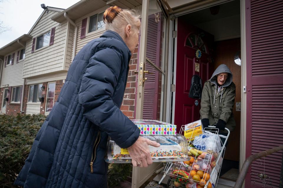 Judy Wollen, 77, of Taylor, left, gets a hand with her groceries from her sister Denise Janiszewski, 67, of Taylor, after they shopped together for groceries at Fish and Loaves, a food pantry in Taylor on Friday, March 3, 2023. The two have relied on expanded SNAP benefits during the pandemic. The additional benefits are being discontinued this month.