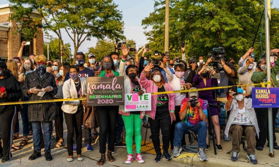 Kamala Harris’s supporters hold signs outside an International Brotherhood of Electrical Workers (IBEW) training facility in Milwaukee last week.