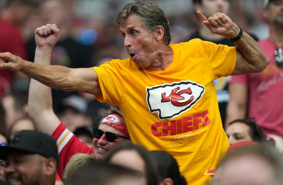 Sep 11, 2022; Glendale, Arizona, United States; Kansas City Chiefs fans cheer on their team against the Arizona Cardinals at State Farm Stadium.