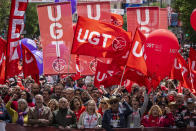 Demonstrators raise their fists as they take part in a May Day rally in Madrid, Wednesday, May 1, 2024. (AP Photo/Bernat Armangue)